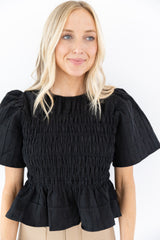 Alexis Rusched Smocked Peplum Top in Black