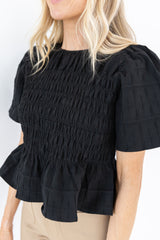 Alexis Rusched Smocked Peplum Top in Black